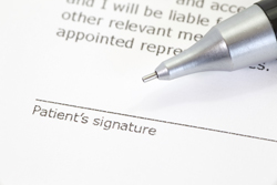 image of a pen near the signature line of a document